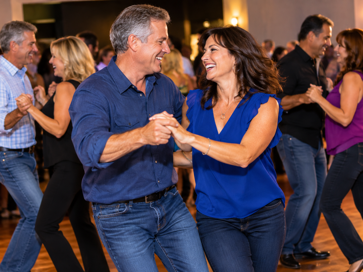 Adults dancing joyfully at a community event